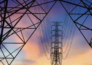 power lines and tower in sunset light