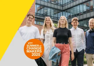 Five young people standing together outdoors, smiling confidently, with a modern office building in the background. The image promotes &#039;VTT Summer of Changemakers 2025,&#039; featuring a bright yellow and orange design element.