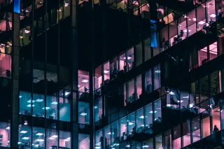 tall office building with lights night time