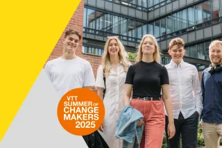 Five young people standing together outdoors, smiling confidently, with a modern office building in the background. The image promotes &#039;VTT Summer of Changemakers 2025,&#039; featuring a bright yellow and orange design element.